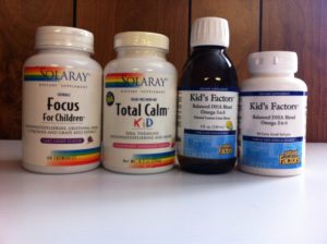four bottles of children's supplements