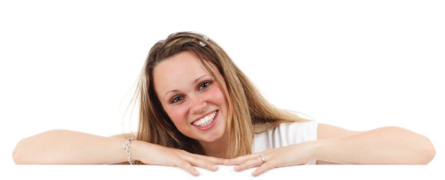 young woman smiling happy after having had her teeth whitened