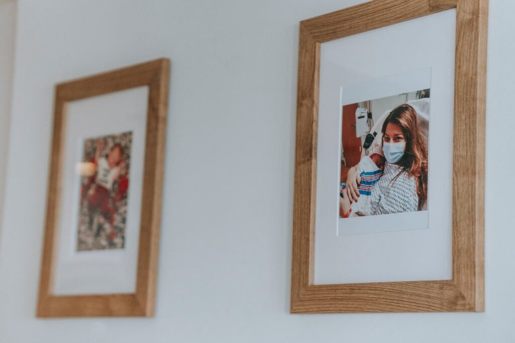 framed family photos on a wall