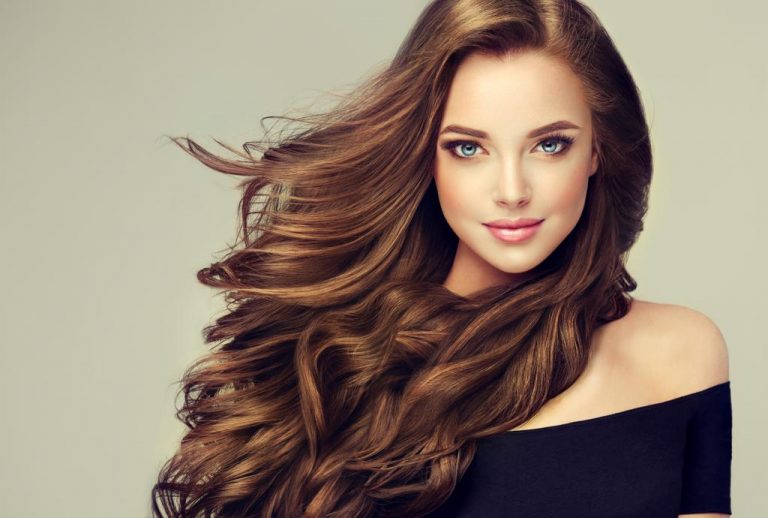 Brunette girl with long and shiny wavy hair