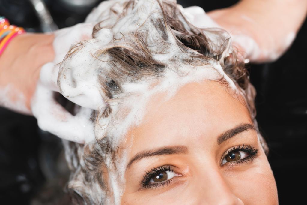 Close up of washing hair in hair salon